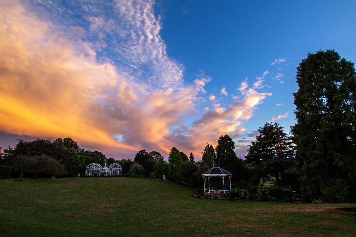 Clouds lit up by the setting sun over the Botanical Gardens